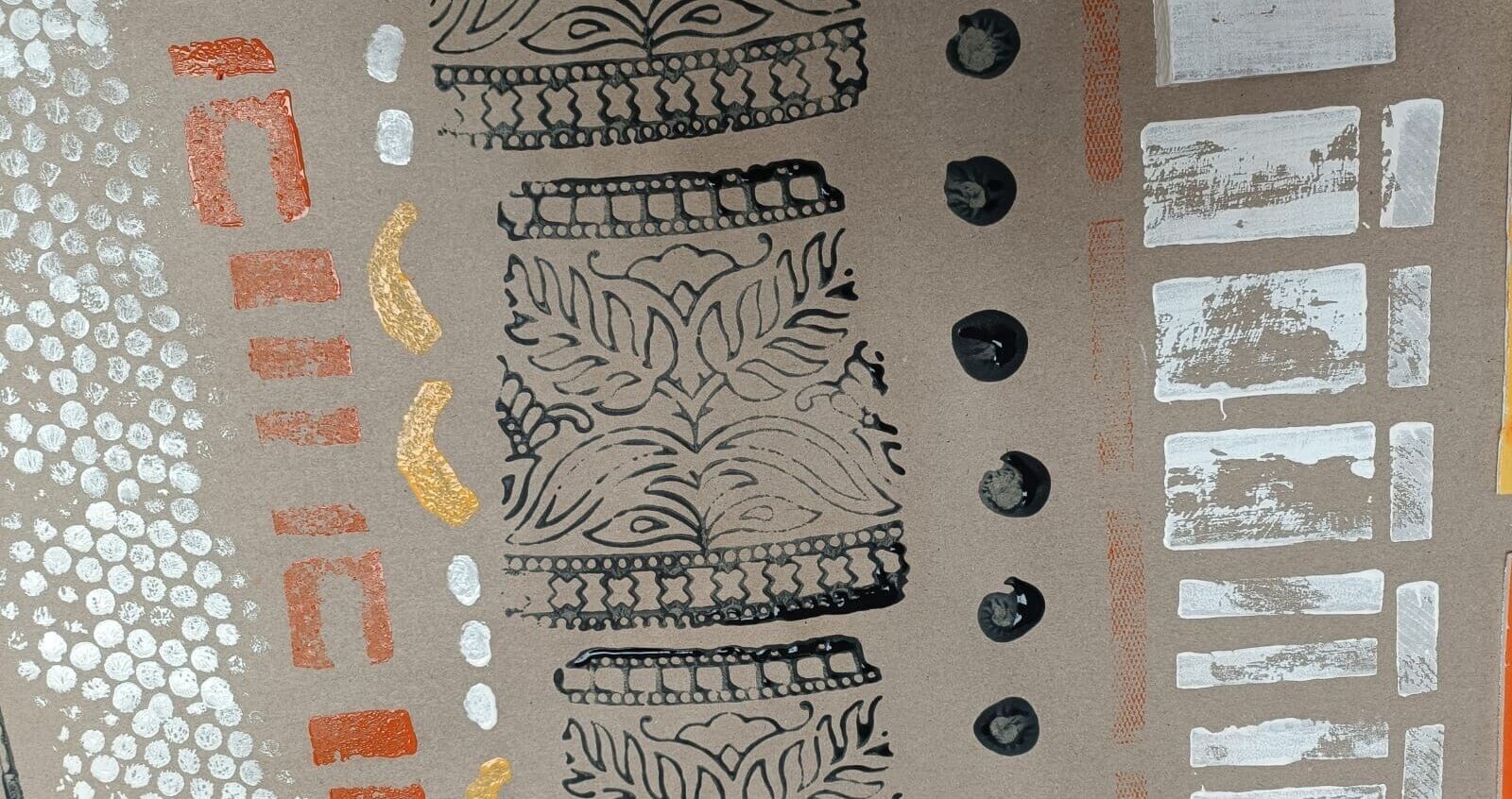A sheet of paper covered with different patterns and muted colours.