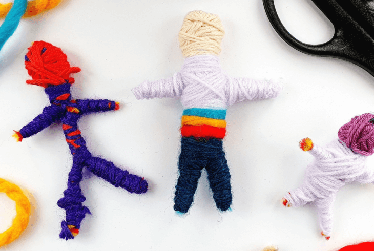 Small figures made from colourful wool on a white background. Image ©HanaSharkey.