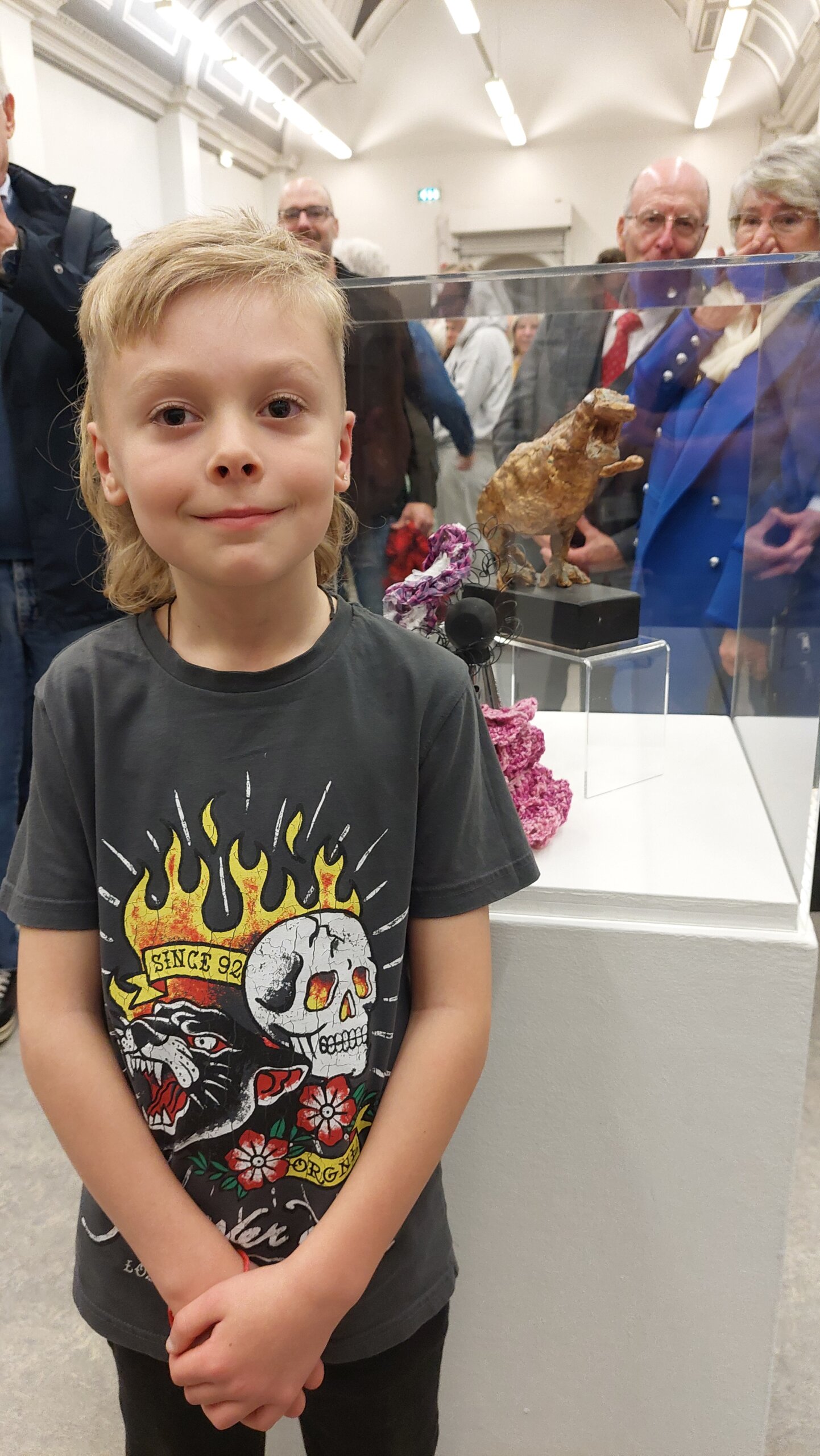 Artist standing next to winning artwork