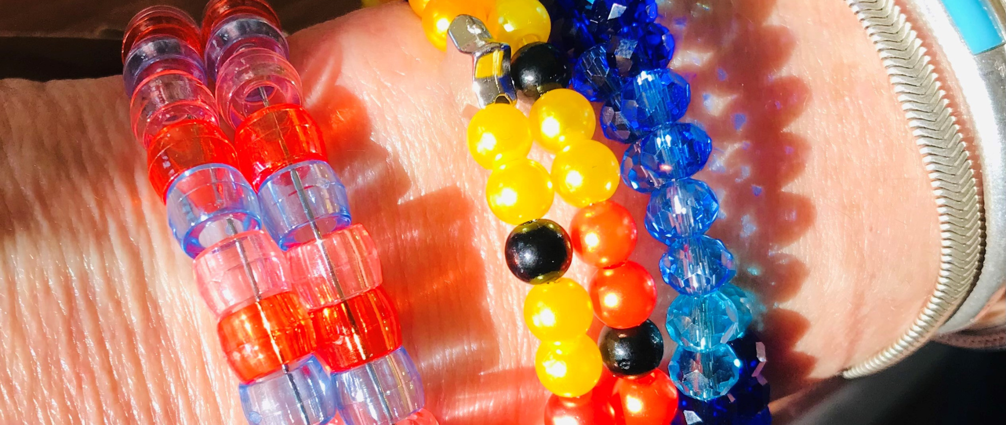 Beaded bracelets on a persons wrist