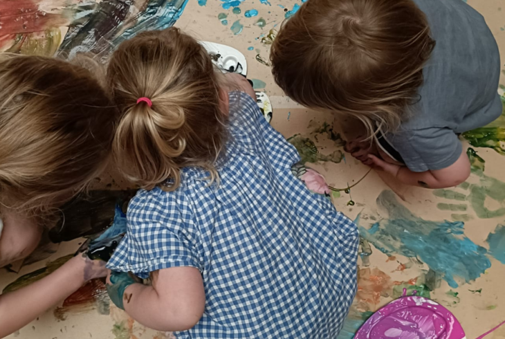 Children painting in Make your Mark session