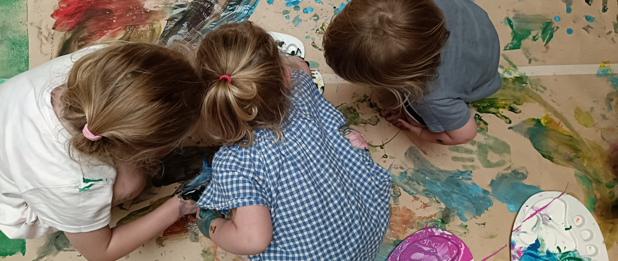 Children painting in Make your Mark session