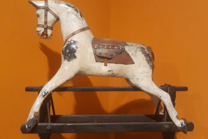 Horse against orange wall