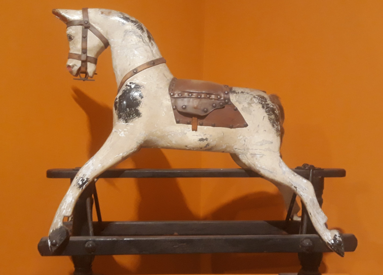 Horse against orange wall