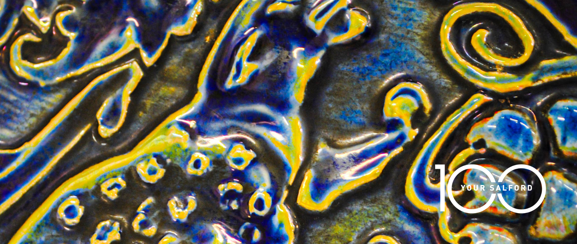 Pilkington's tile with Your Salford 100 logo